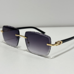 Luxury Cartier sunglasses with gold accents and dark lenses.