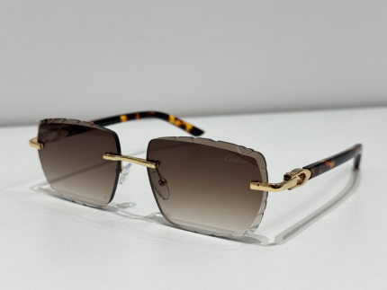 Elegant Cartier women's sunglasses with gold accents and gradient lenses.