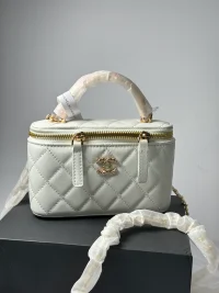 Elegant white quilted women's handbag with gold accents.