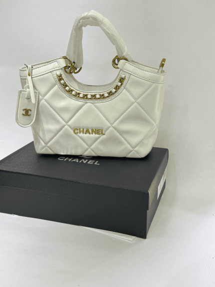 Elegant Chanel Tote Bag with quilted design and gold accents.