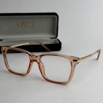Syze Qetesuese Blue Control glasses with stylish frame and case.