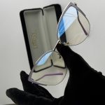 Syze Qetesuese Blue Control glasses with protective case.