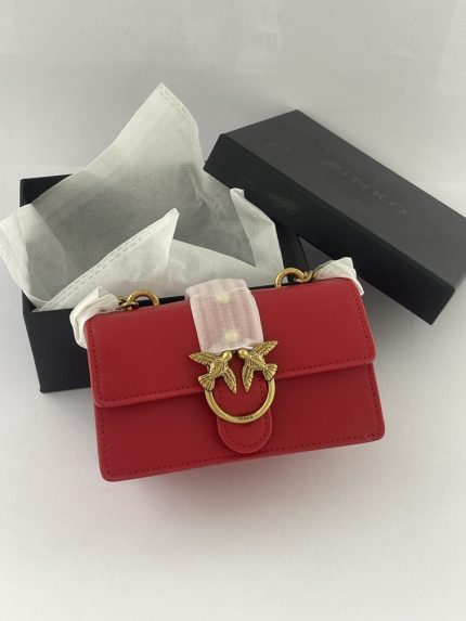 Pinko Love Bag red handbag in open box with tissue paper.