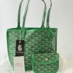 Green Goyard Saint Louis Tote with matching pouch, elegant design.