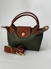 Çantë Femrash Longchamp green handbag with brown leather accents.