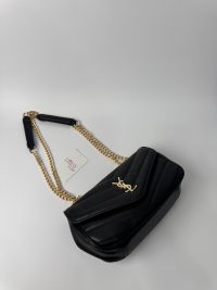 Black YSL LouLou bag with gold chain strap on display.