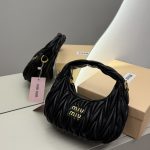 Black Miu Miu Wander Bag on display with packaging.