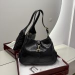 Gucci Jackie 1961 Hobo bag in black leather on display.