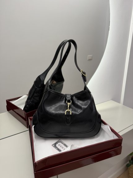 Gucci Jackie 1961 Hobo bag in black leather on display.