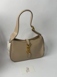 Beige YSL Le5A7 Hobo bag with gold logo and strap.