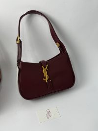 YSL Le5A7 Hobo burgundy handbag with gold logo detail.