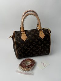 YSL Le5A7 Hobo women's bag with monogram pattern and leather handles.