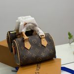 Luxury designer handbag with monogram pattern on display.