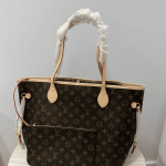 Louis Vuitton Neverfull bag with monogram design on table.