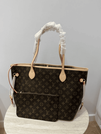 Louis Vuitton Neverfull bag with monogram design on table.