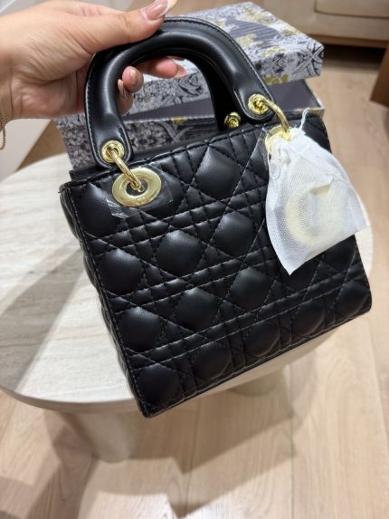 Elegant black Christian Dior Book Tote with quilted leather design.