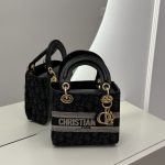Christian Dior Elegante handbag with gold accents on display.