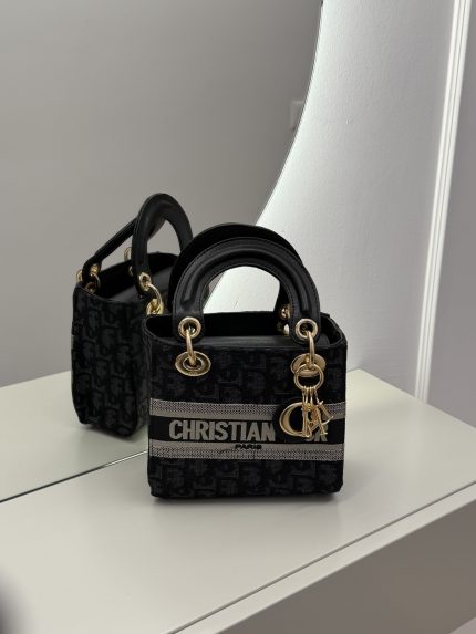 Christian Dior Elegante handbag with gold accents on display.