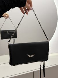 Elegant black Zadig & Voltaire handbag with chain strap.