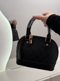 Louis Vuitton Nano Speedy black handbag with monogram design.