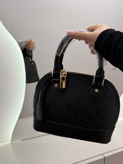 Louis Vuitton Nano Speedy black handbag with monogram design.