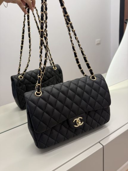 Classic Chanel women's handbag with quilted design and gold chain strap.