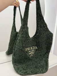 Green Prada Boucle beach bag with logo embroidery.
