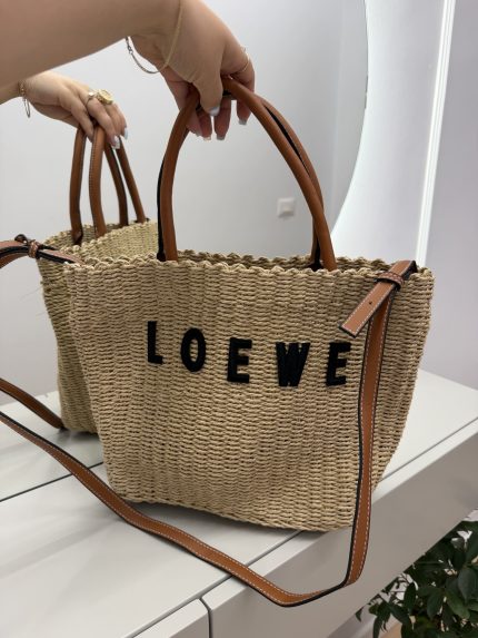 Loewe beach bag with leather handles and woven texture elegance.