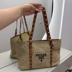 Prada Knit Tote with brown straps, elegant woven design.