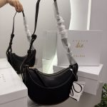 Canta Polene Numero Dix black handbag with packaging and mirror reflection.