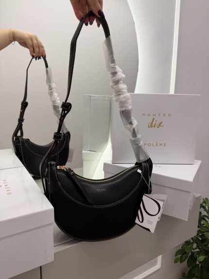 Canta Polene Numero Dix black handbag with packaging and mirror reflection.
