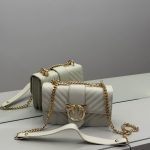 Elegant Çanta Pinko bag with gold chain and bird emblem.