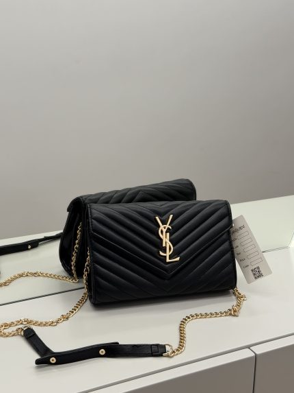 Elegant black YSL women's bag with gold chain and logo.