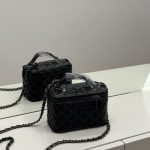 Elegant black quilted Chanel vanity bag with chain strap for women.