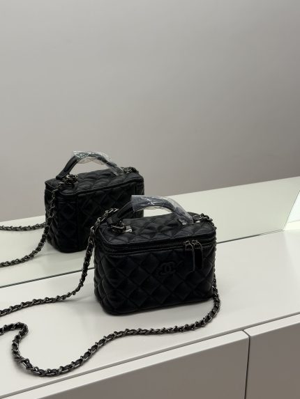 Elegant black quilted Chanel vanity bag with chain strap for women.
