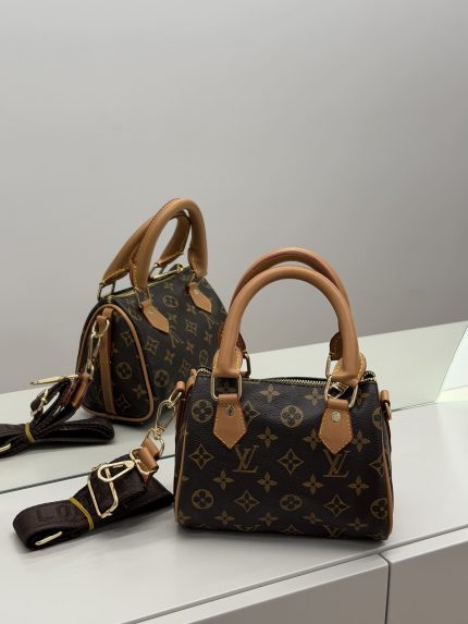 Louis Vuitton Speedy handbag with monogram design on display.