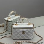 White quilted Chanel vanity bag with gold chain for women.