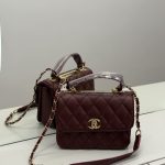 Elegant Chanel Flap bag with quilted design and gold chain strap.
