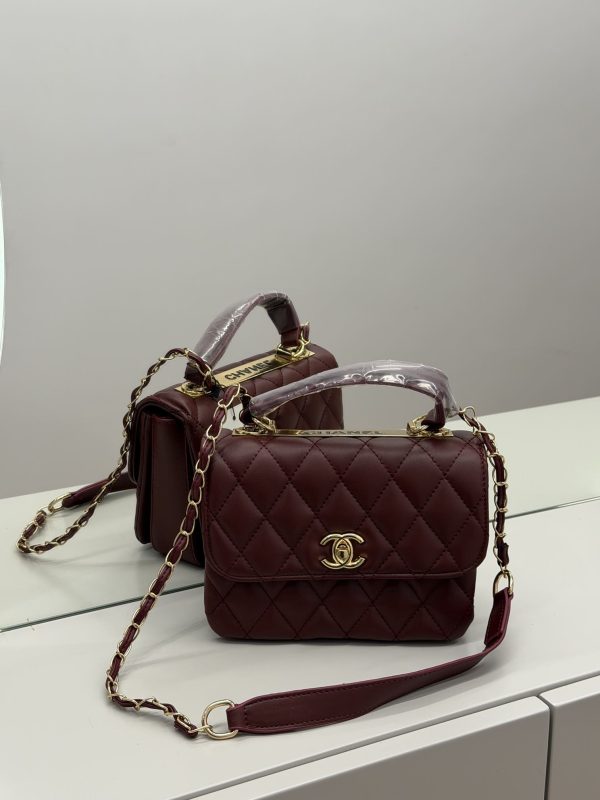 Elegant Chanel Flap bag with quilted design and gold chain strap.