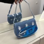 Denim Diesel 1DR women's handbag with blue logo accent.
