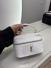 White YSL Vanity Case për Femra with quilted design and gold logo.