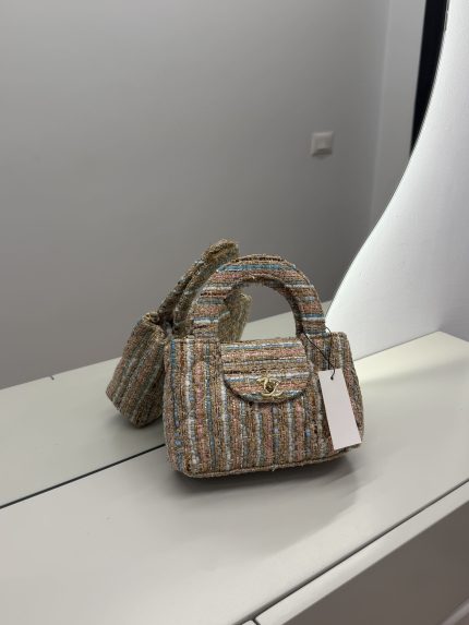 Chanel Tweed Mini Bag on display, elegant for any occasion.