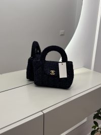 Chanel Tweed Mini Bag on mirrored surface, elegant and versatile.