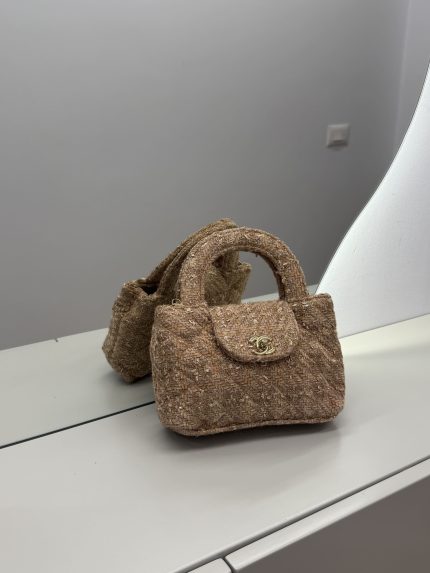 Chanel Tweed Mini Bag on mirror, elegant for any occasion.