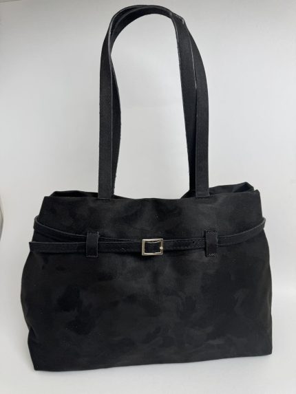 Elegant black suede handbag with strap and buckle detail.