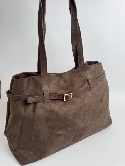 Brown suede handbag with strap, elegant and stylish design.