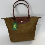 Longchamp Le Pliage XL brown tote bag with leather handles.