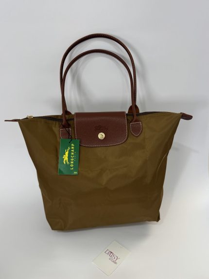 Longchamp Le Pliage XL brown tote bag with leather handles.