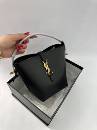 Black Masa mini nailon bag with gold logo in box.