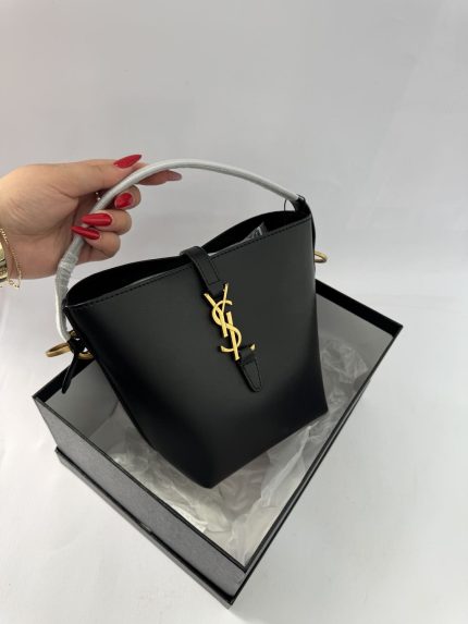 Black Masa mini nailon bag with gold logo in box.